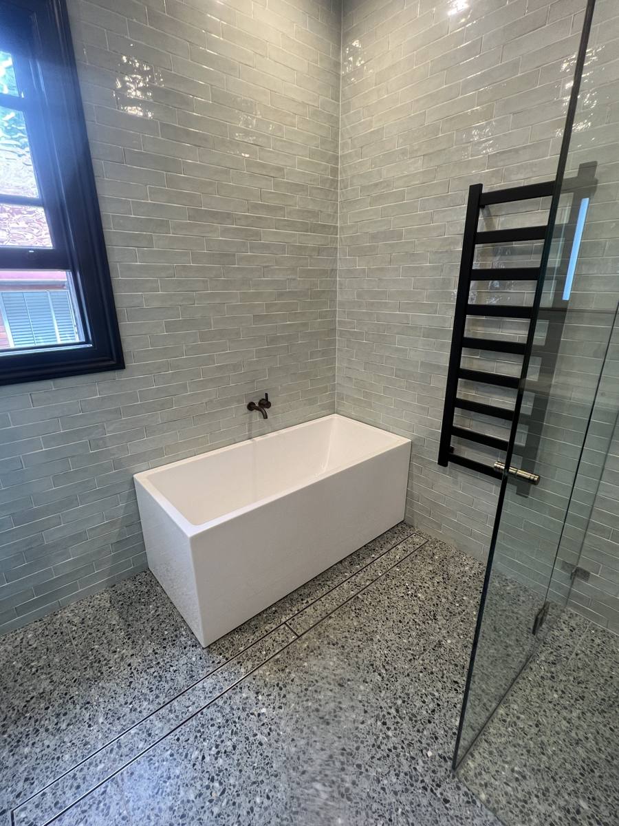 A finished bathroom with a freestanding bath