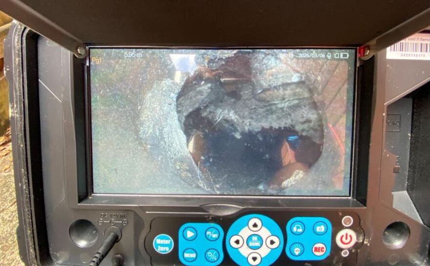 Drain camera image showing a damaged section of sewer pipe