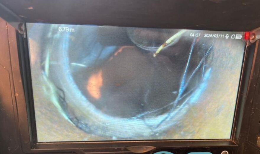 Drain camera screen showing roots in a pipe joint at 6.79 metres