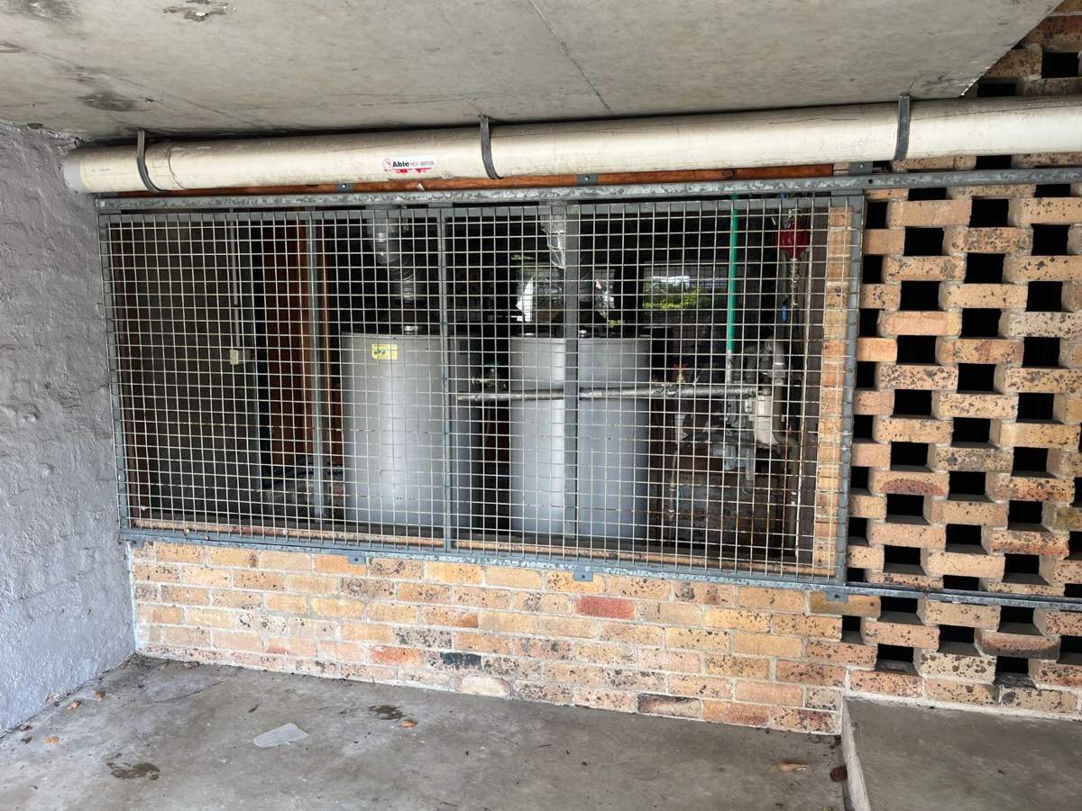 Hot water units installed against an exterior wall