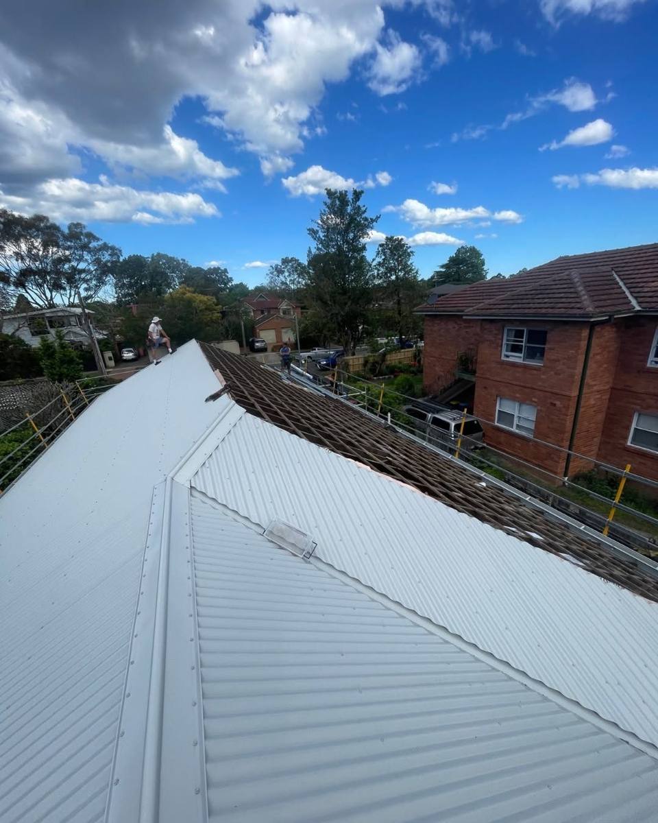 Newly finished metal roof with ridge capping